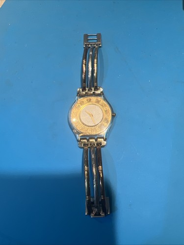 Orologio swatch tri - orologio, tri-gold